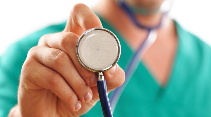 Doctor holding stethoscope (with shallow depth of field)